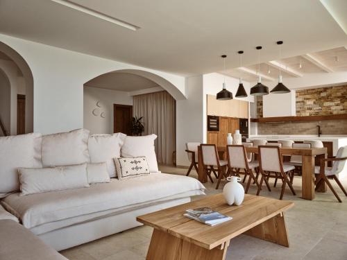 a living room with a couch and a table at Thesan Villas in Marathias