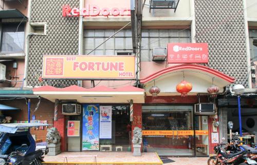 a store front of a store with a sign for a store at RedDoorz Plus @ Chinatown Binondo in Manila