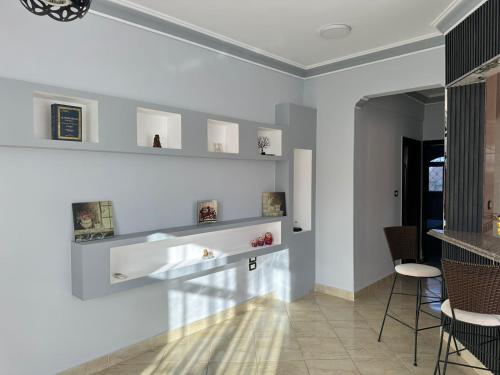 a living room with white walls and shelves on the wall at Private villa in Hurghada in Hurghada