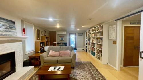 a living room with a chair and a fireplace at Near downtown with hot tub sleeps seven in Blacksburg
