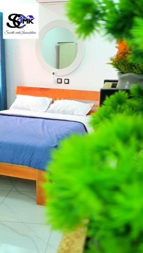 Llit o llits en una habitació de Les Résidences JMK