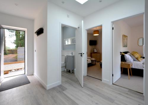 a room with a mirror and a bedroom at Tree Tops in Lulsgate Bottom