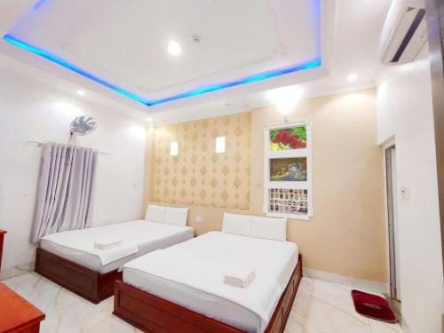 Ένα ή περισσότερα κρεβάτια σε δωμάτιο στο Sao Mai Hotel Can Tho
