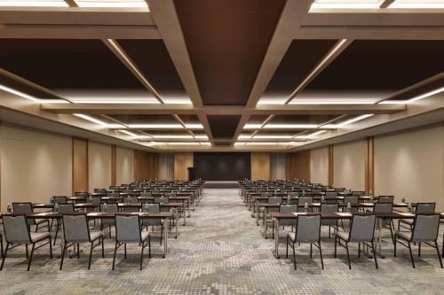 a large room with tables and chairs in it at Courtyard by Marriott Nanning Wuxiang in Nanning
