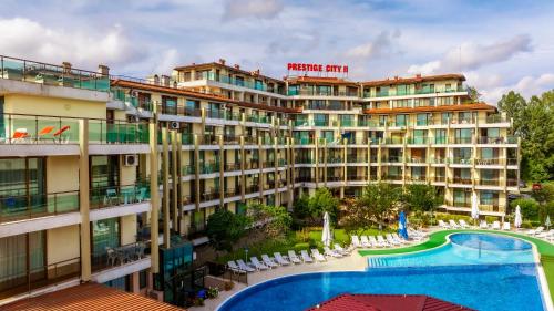 a hotel with a swimming pool and a resort at Aparthotel Hotel Prestige City II in Primorsko