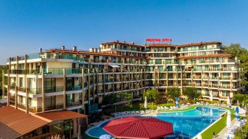 a hotel with a swimming pool and a resort at Aparthotel Hotel Prestige City II in Primorsko