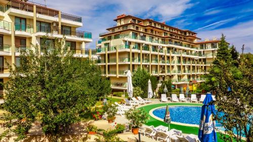 a hotel with a swimming pool and a resort at Aparthotel Hotel Prestige City II in Primorsko
