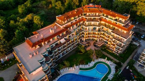 an aerial view of a resort with a pool at Aparthotel Hotel Prestige City II in Primorsko