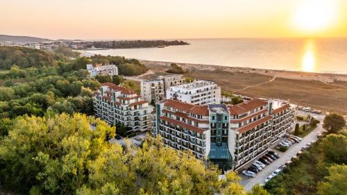 an aerial view of a building next to a beach at Aparthotel Hotel Prestige City II in Primorsko