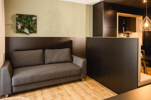 a couch in the corner of a room at Rioca Konstanz Posto 10 in Konstanz