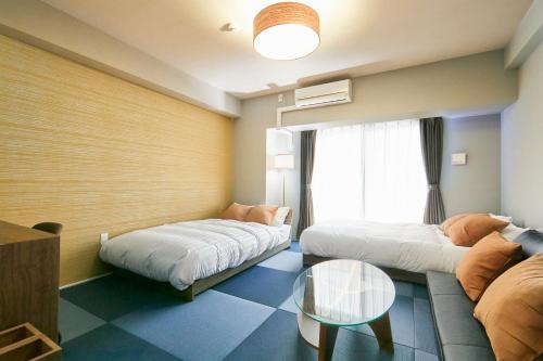 Katil atau katil-katil dalam bilik di LINK HOUSE HOTEL - スマート無人ステイ - Unmanned design hotel