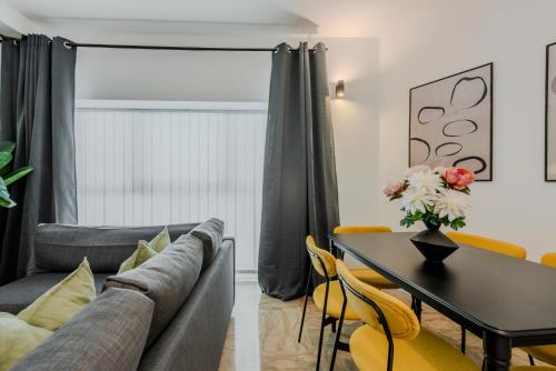 a living room with a couch and a table at Sweett - Mazzini in Milan