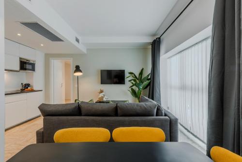 a living room with a couch and a table at Sweett - Mazzini in Milan