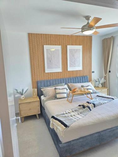a bedroom with two beds and a ceiling fan at Luxury Apartment IZHA 202 in La Laguna