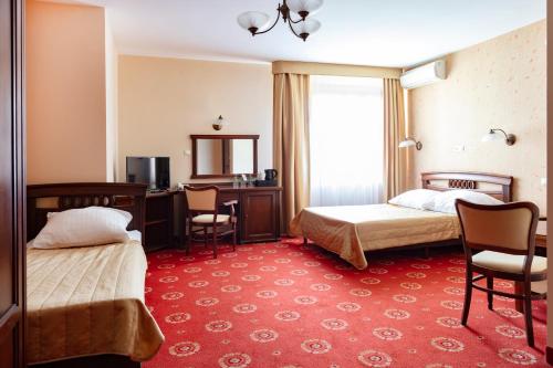 Posteľ alebo postele v izbe v ubytovaní Hotel Arkadia Royal