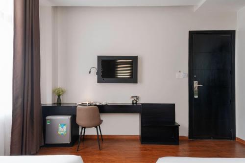 Телевизор и/или развлекательный центр в Nature Hotel - Luong The Vinh