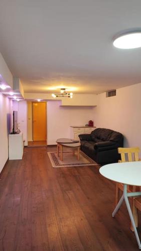 a living room with a couch and a table at nice apartment in Viby in Sollentuna