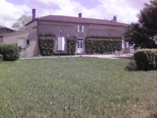 a large house with a yard in front of it at Le Clos de Vrillant in Anglade