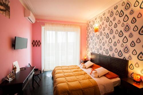 a bedroom with two beds and a large window at City Lights Rome in Rome
