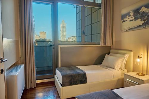 Кровать или кровати в номере Milan Retreats