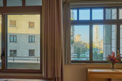 a room with a window with a view of a city at Milan Retreats in Milan
