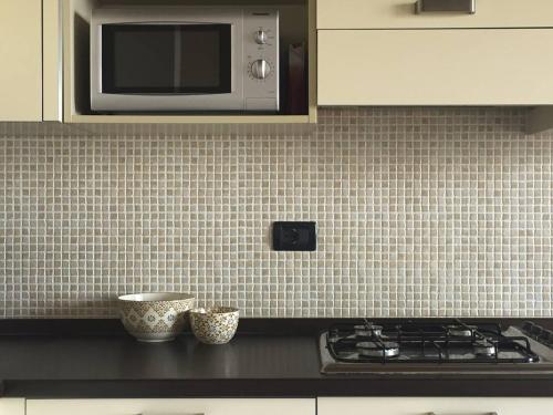 A kitchen or kitchenette at Appartamento Francesco - Theater Home