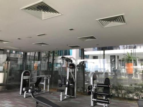 a gym with cardio equipment in a building at Mercu Summer Suites Kuala Lumpur Bukit Bintang By Classy in Kuala Lumpur