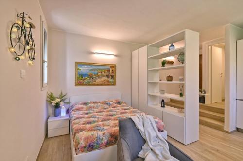 Postel nebo postele na pokoji v ubytování Appartamento Promontorio - Theater Home