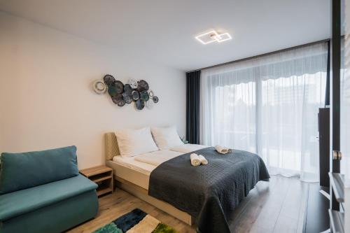 En eller flere senge i et værelse på MyFlat Coral Suite