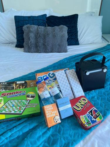 a bed with a bunch of products on it at Alphas Haven in Manila