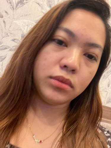 a woman with long hair looking at the camera at Alphas Haven in Manila