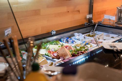 a buffet line with many different types of food at Hotel Pension Futterknecht in Burgau