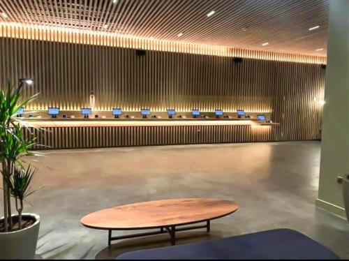 a conference room with a table and blue seats at Tranquil 1 BR Retreat in Piccadilly VR4 in London