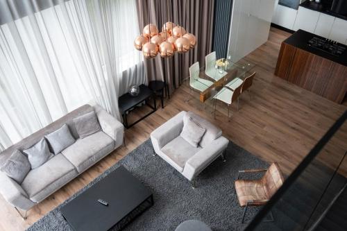 an overhead view of a living room with a couch and chairs at Stunning 3 Bed Penthouse in West End in Glasgow