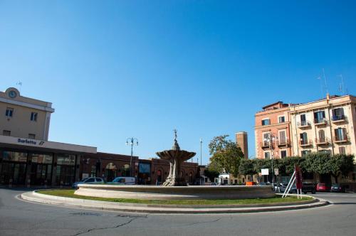 a large fountain in the middle of a city street at Luxury Suite Station in Barletta