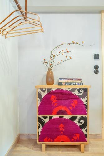 a cabinet with a colorful rug on top of it at Kaszelewskiego1 in Zakopane