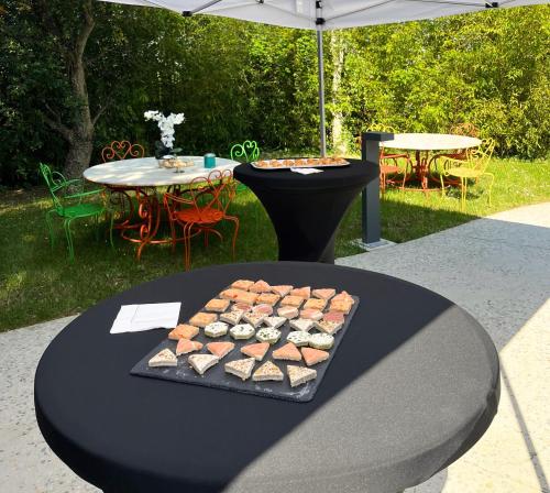 a table with a tray of food on it at Brit Hotel Ker Lann Aeroport - Parc Expo in Bruz