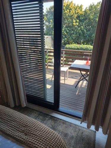 a sliding glass door with a view of a patio at Sea Dreams Guesthouse in Ballito