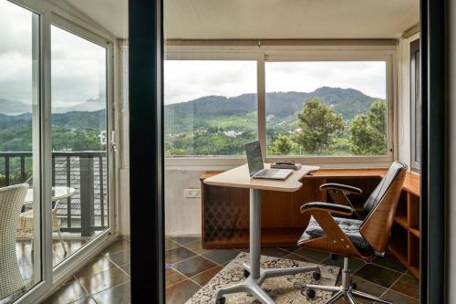 an office with a desk and a laptop on a table at Shangrila Casa-Premium Homestay in Lovedale