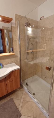 a bathroom with a shower and a sink at Casa Anna Mezzana in Mezzana