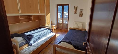 Posteľ alebo postele v izbe v ubytovaní Casa Anna Mezzana