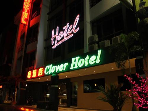a neon sign for a hotel on a building at Clover Hotel in Johor Bahru