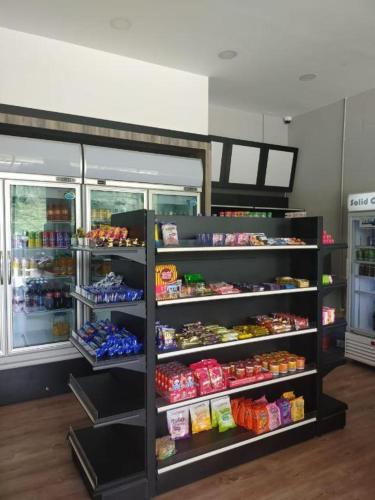 a store filled with lots of different types of food at Alia Express Sendayan in Seremban