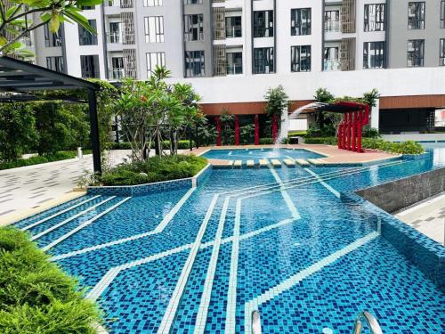 a swimming pool in the middle of a building at Sentral Suites By Eassy Hotel in Kuala Lumpur