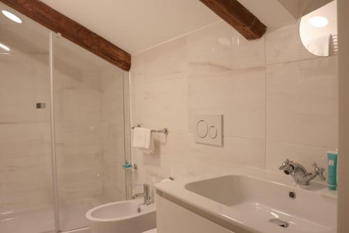 a bathroom with a tub and a sink and a shower at Al Bailo Di Venezia in Venice