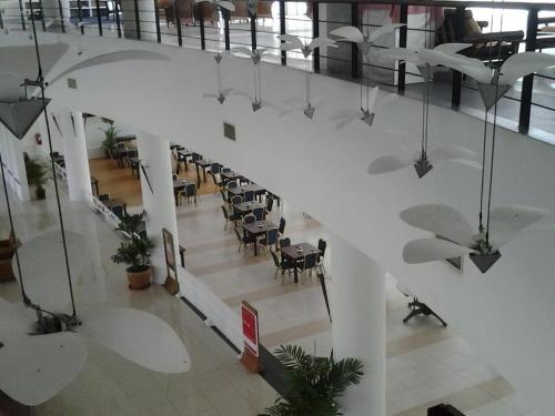 an overhead view of a lobby with chairs and tables at Century Helang Hotel in Pantai Cenang