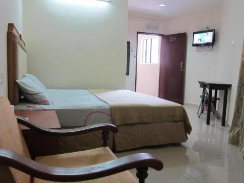Кровать или кровати в номере Skudai Baru Hotel