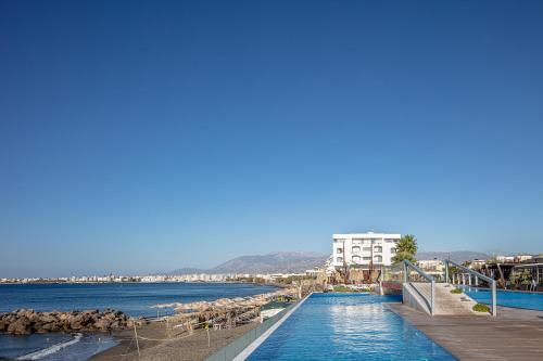 a view of a river with buildings in the background at Petra Mare in Ierápetra