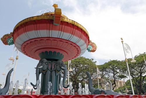 a pagoda with an elephant statue in a park at Capital O 90574 Hotel Glo in Kuala Lumpur