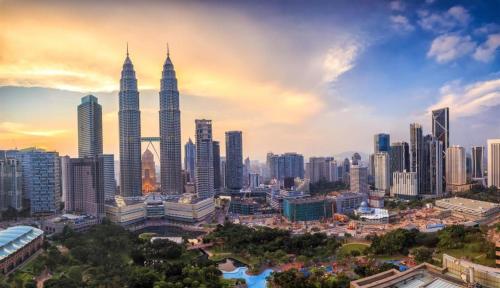 a skyline of a city with tall buildings at Capital O 90574 Hotel Glo in Kuala Lumpur